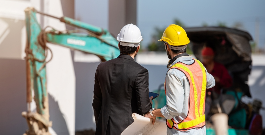 construction worker and engineer-working together in a construction site